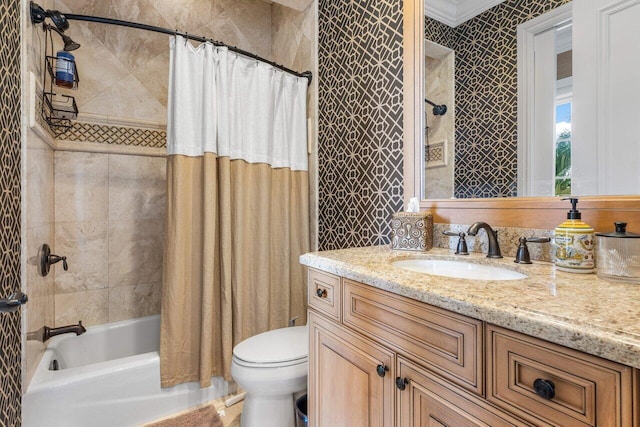 full bathroom with vanity, ornamental molding, toilet, and shower / bath combo with shower curtain