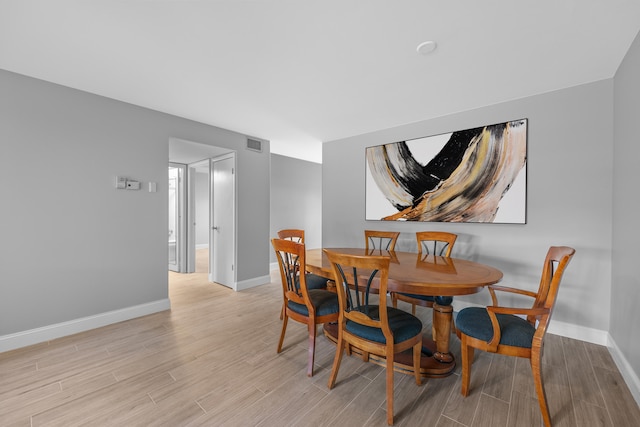 dining space featuring light hardwood / wood-style flooring