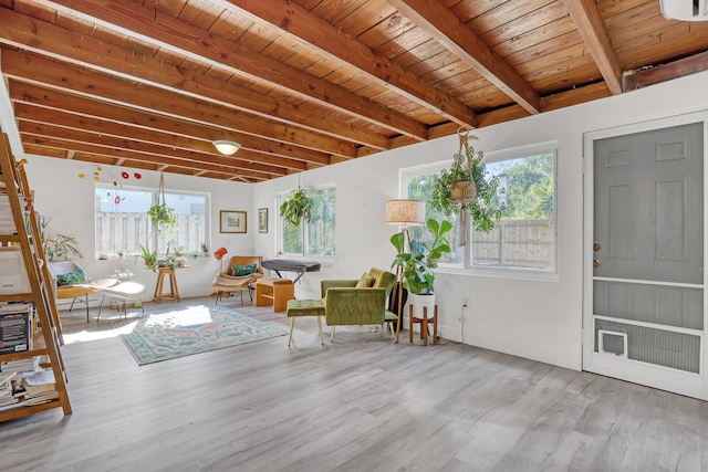 unfurnished sunroom with beamed ceiling and wooden ceiling