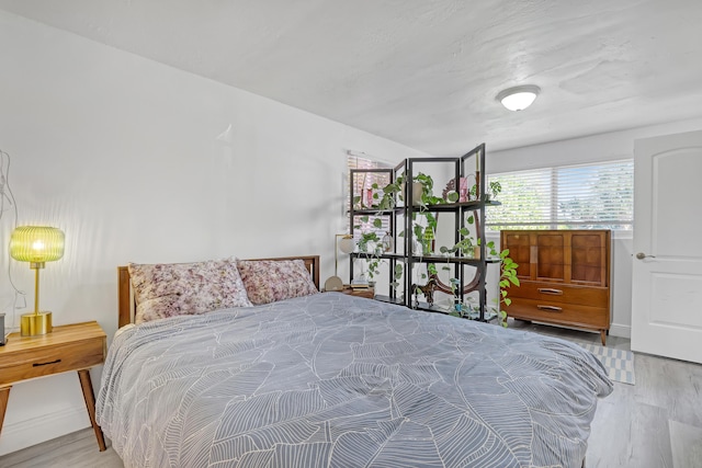 bedroom with wood-type flooring