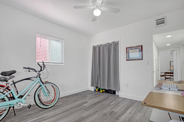 interior space with light hardwood / wood-style flooring and ceiling fan