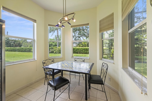 sunroom featuring breakfast area