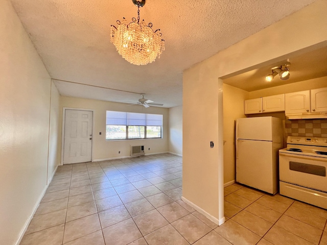 kitchen with light tile patterned floors, pendant lighting, white appliances, decorative backsplash, and white cabinets