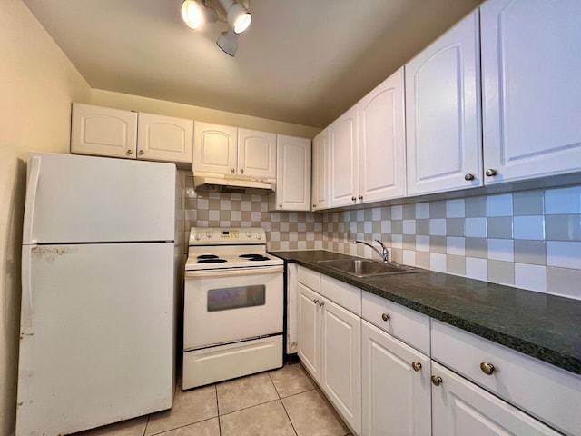 kitchen with sink, light tile patterned floors, white cabinets, and white appliances