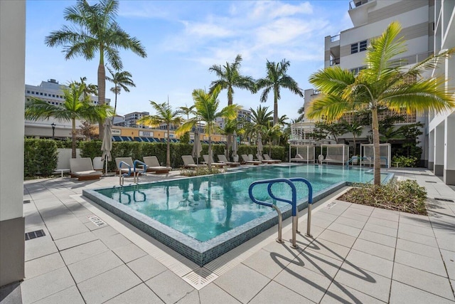 view of swimming pool with a patio