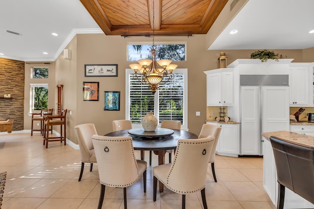 tiled dining space featuring an inviting chandelier, wood ceiling, ornamental molding, and a healthy amount of sunlight