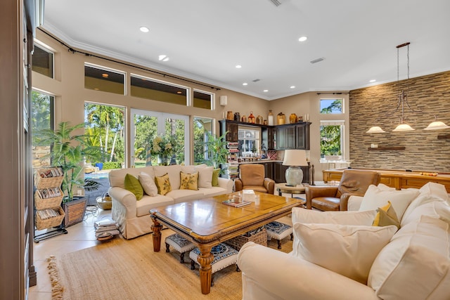 living room with crown molding and light tile patterned floors