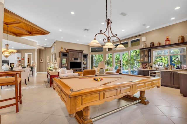 recreation room featuring crown molding, pool table, bar, and light tile patterned floors