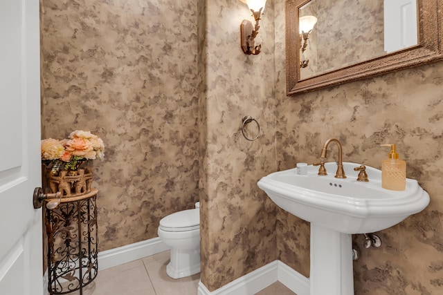 bathroom with tile patterned flooring and toilet