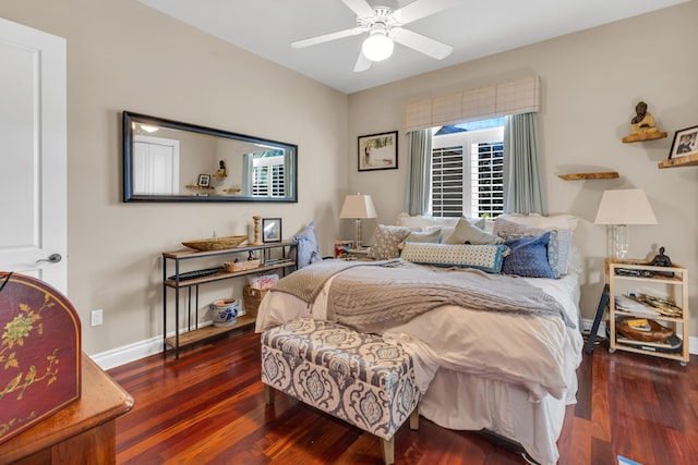 bedroom with dark hardwood / wood-style floors and ceiling fan