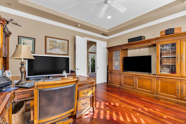 office with ceiling fan, ornamental molding, dark hardwood / wood-style floors, and a raised ceiling