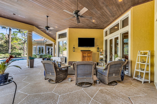 view of patio with an outdoor living space, french doors, and ceiling fan