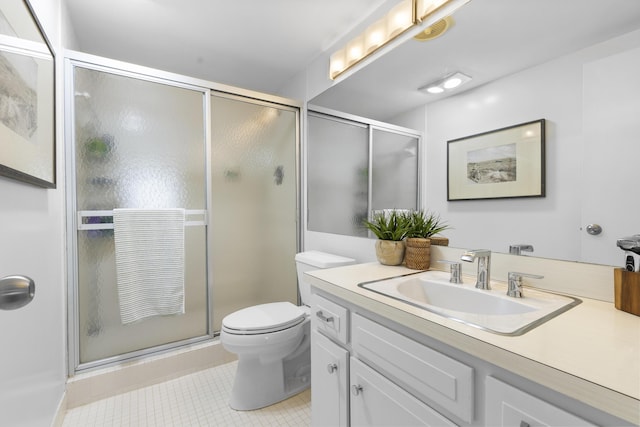 full bathroom with vanity, toilet, tile patterned flooring, and a stall shower