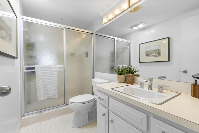 bathroom with vanity, an enclosed shower, tile patterned floors, and toilet