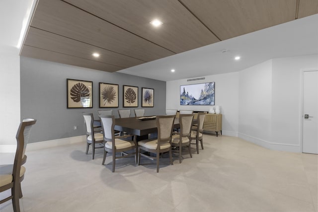 dining space featuring light carpet, baseboards, and recessed lighting