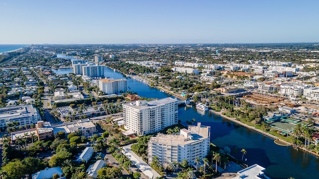 birds eye view of property with a view of city and a water view