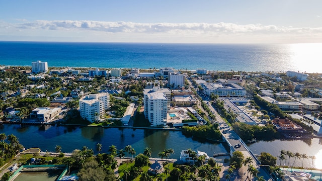 aerial view featuring a water view and a view of city