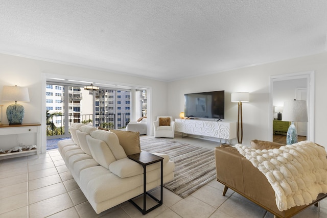 living area with a textured ceiling and light tile patterned floors