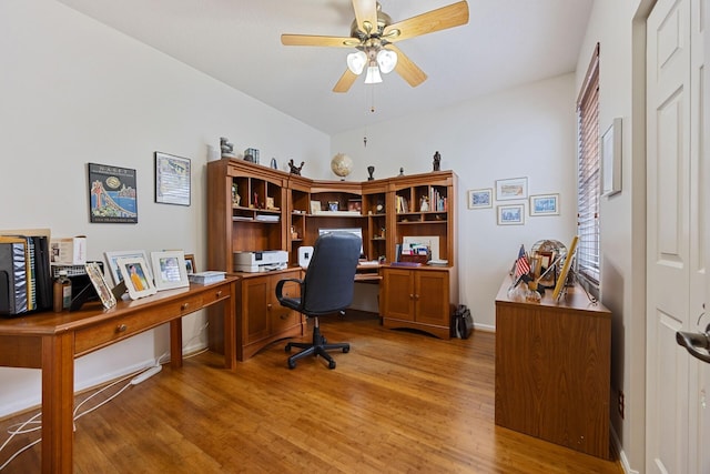 home office featuring ceiling fan and light hardwood / wood-style flooring