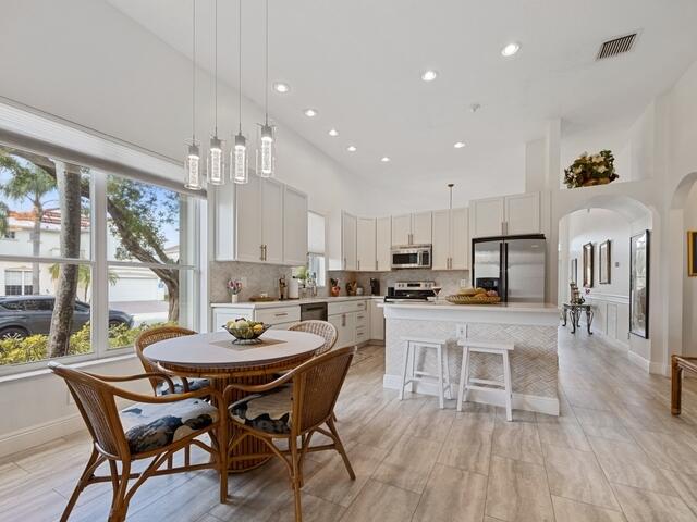 dining room featuring a high ceiling