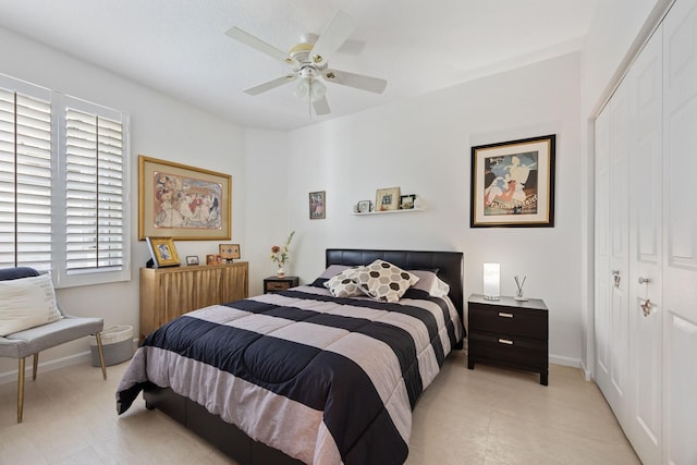 bedroom featuring ceiling fan and a closet