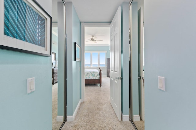 corridor with light colored carpet