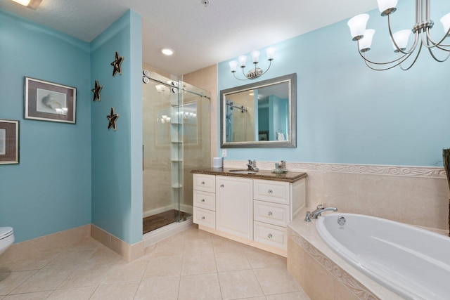 full bathroom featuring tile patterned flooring, shower with separate bathtub, a notable chandelier, and vanity