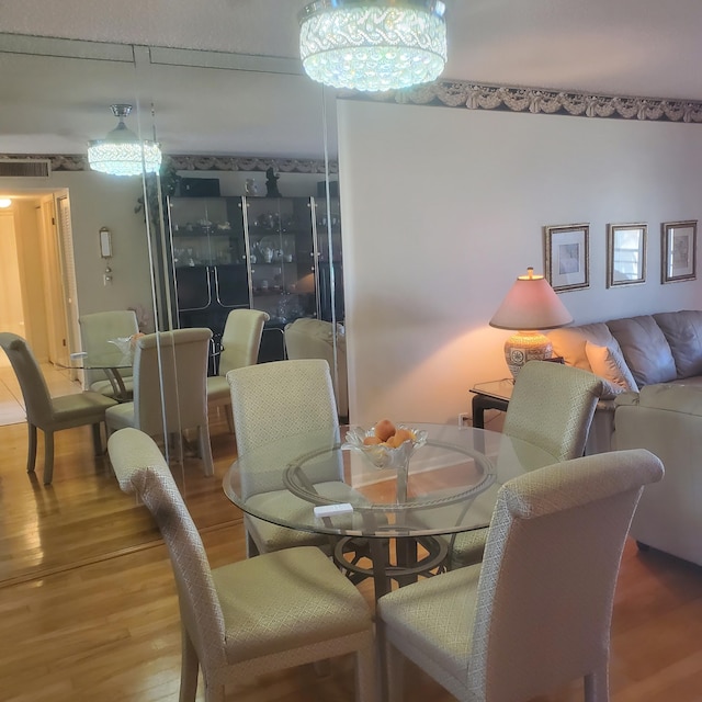 dining area with hardwood / wood-style floors