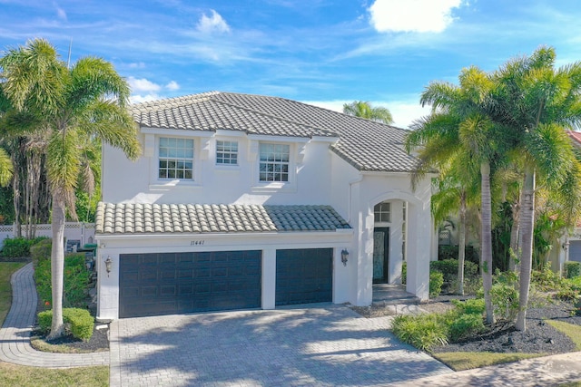 mediterranean / spanish house with a garage