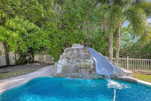 view of pool featuring a water slide