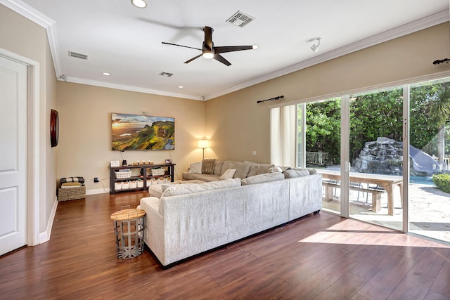 living room featuring dark hardwood / wood-style flooring, ornamental molding, and ceiling fan