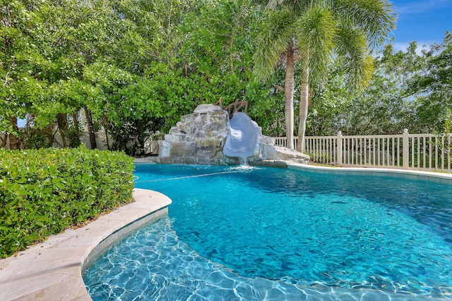 view of pool with a water slide