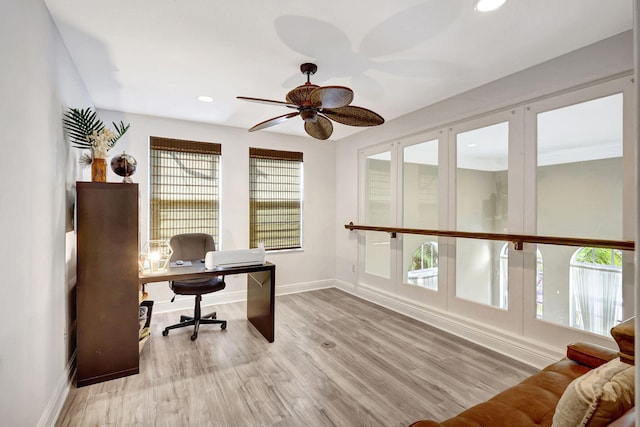 office space featuring light hardwood / wood-style floors and ceiling fan