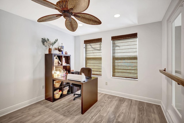 office space featuring light hardwood / wood-style floors and ceiling fan