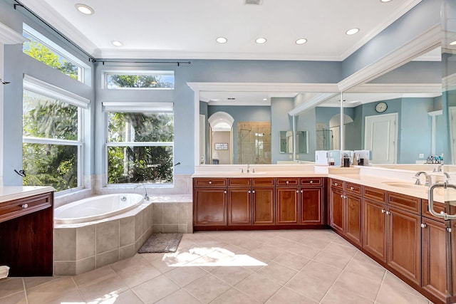 bathroom with vanity, tile patterned flooring, and shower with separate bathtub