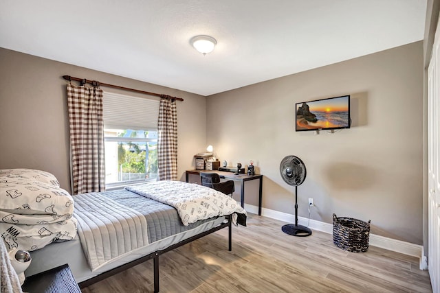 bedroom with light hardwood / wood-style floors