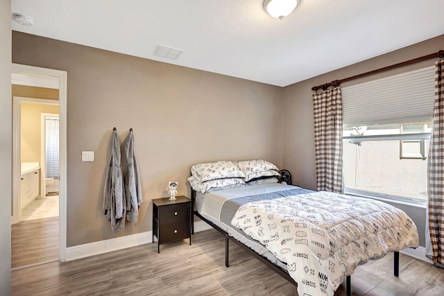 bedroom featuring wood-type flooring