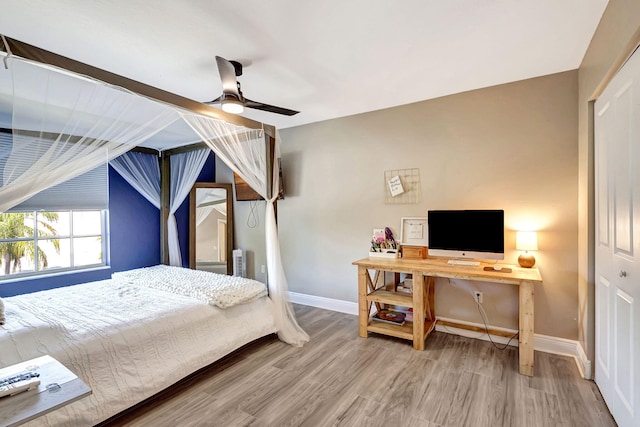 bedroom with hardwood / wood-style flooring and ceiling fan