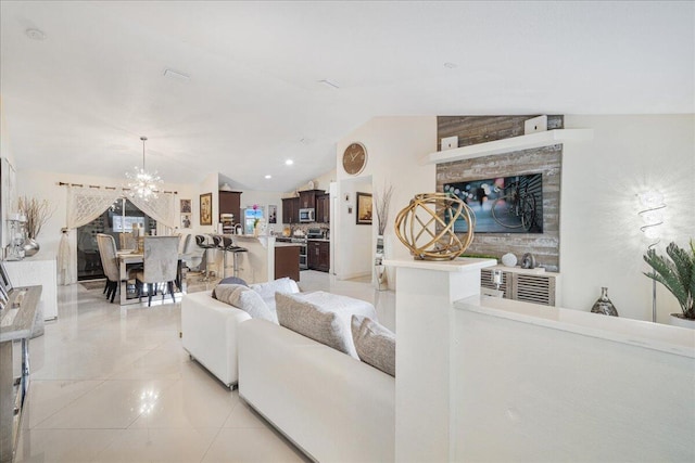 living room with light tile patterned flooring, lofted ceiling, and a chandelier