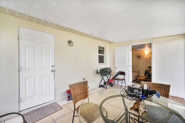 entrance to property featuring a patio