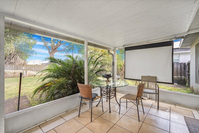 unfurnished sunroom featuring a healthy amount of sunlight