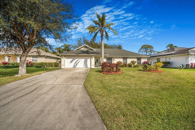 ranch-style house featuring a garage and a front yard