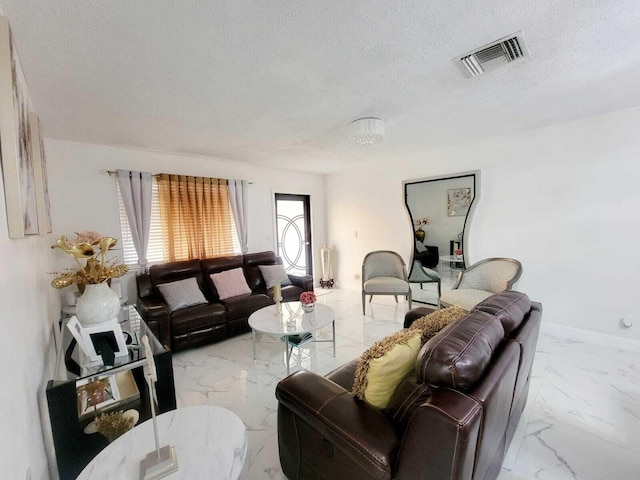 living room with a textured ceiling