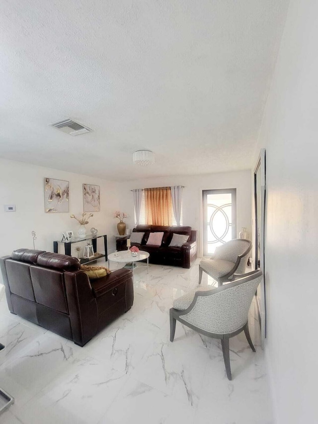 living room with a textured ceiling