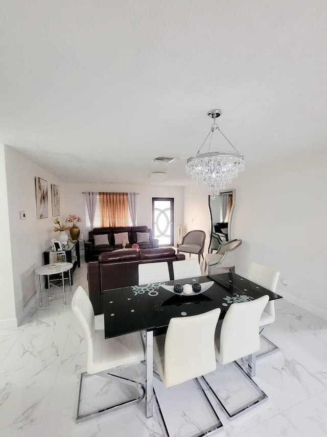 dining room with a chandelier