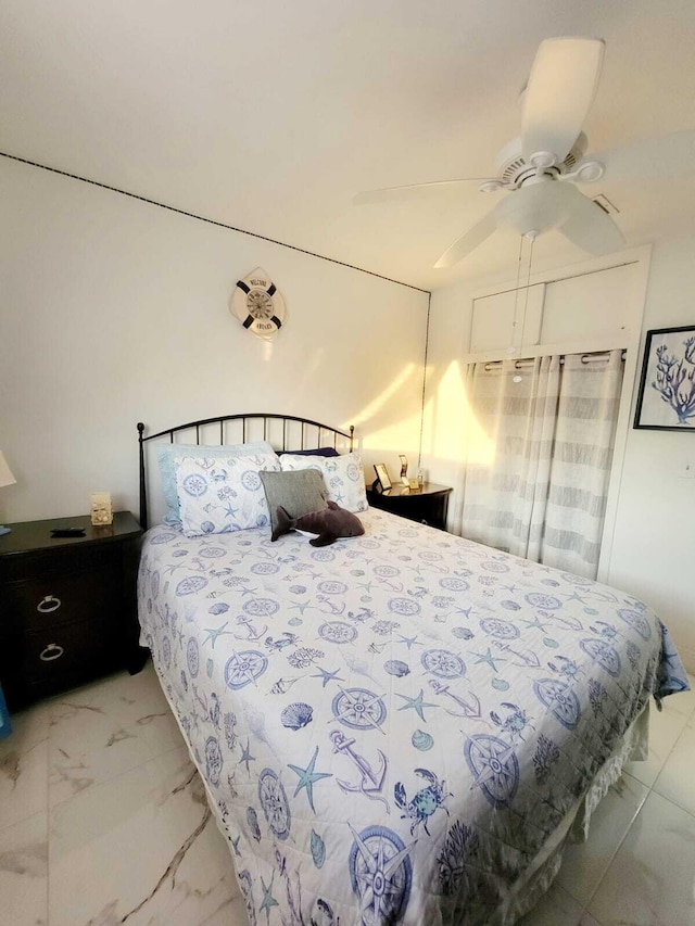 bedroom featuring ceiling fan