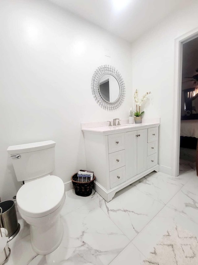 bathroom with vanity and toilet