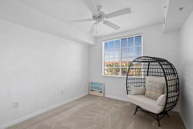 unfurnished room featuring ceiling fan and light colored carpet