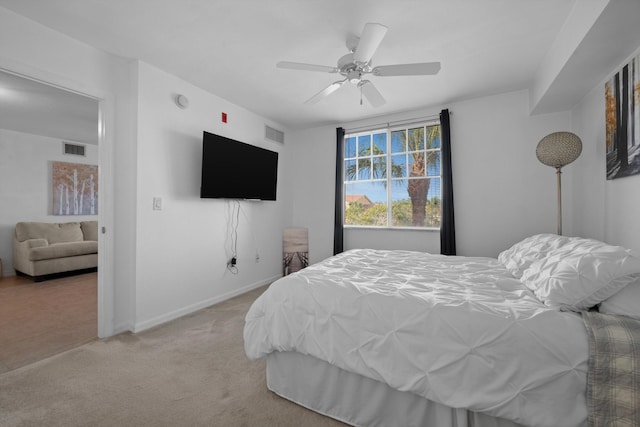 bedroom with ceiling fan and light colored carpet