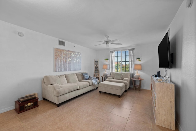 living room featuring ceiling fan and light tile patterned flooring